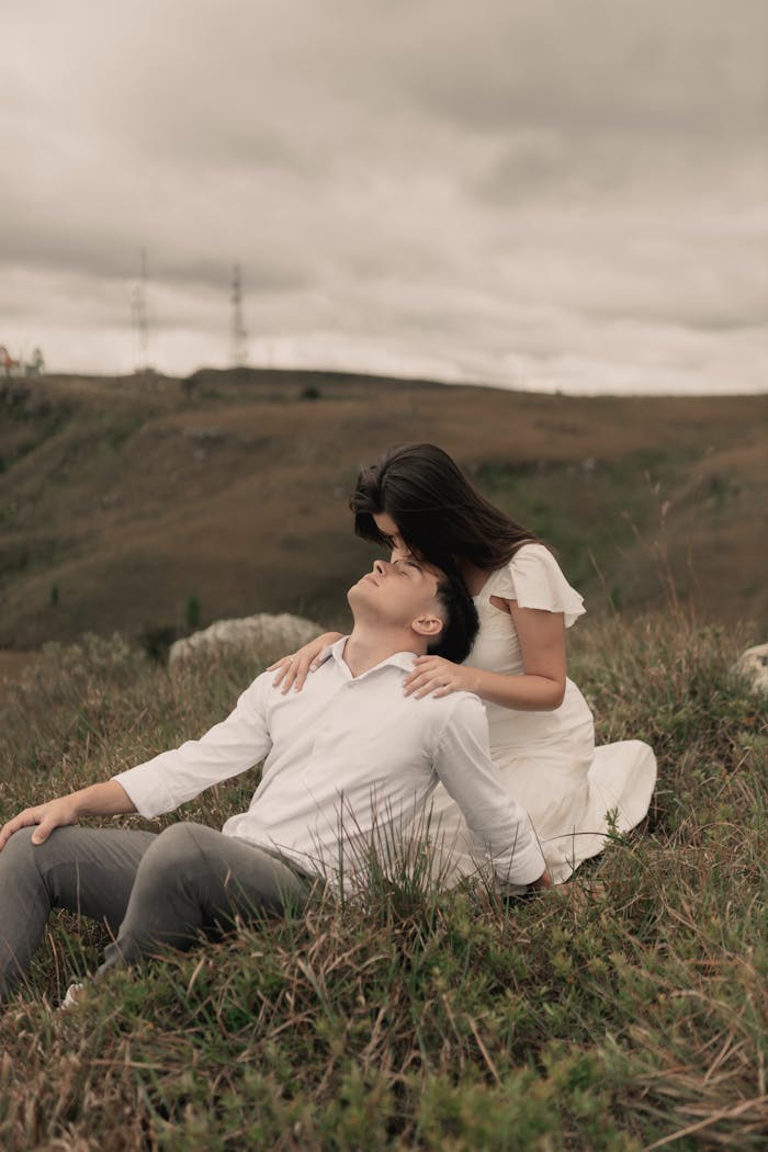 services-img A loving couple embraces on a serene hilltop, creating a peaceful moment.